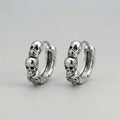 Stacked Skull Huggie Hoop Earrings