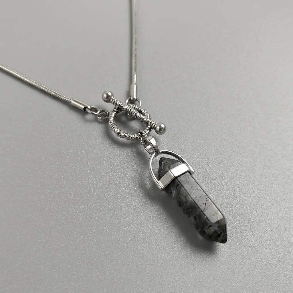 Serpentine Cipher Crystal Point Necklace